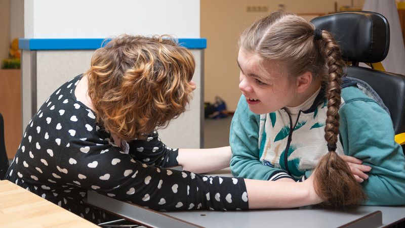 A Nurse Providing Care for a Disabled Child. 